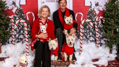 Kay DeLoach with his wife and westies.
