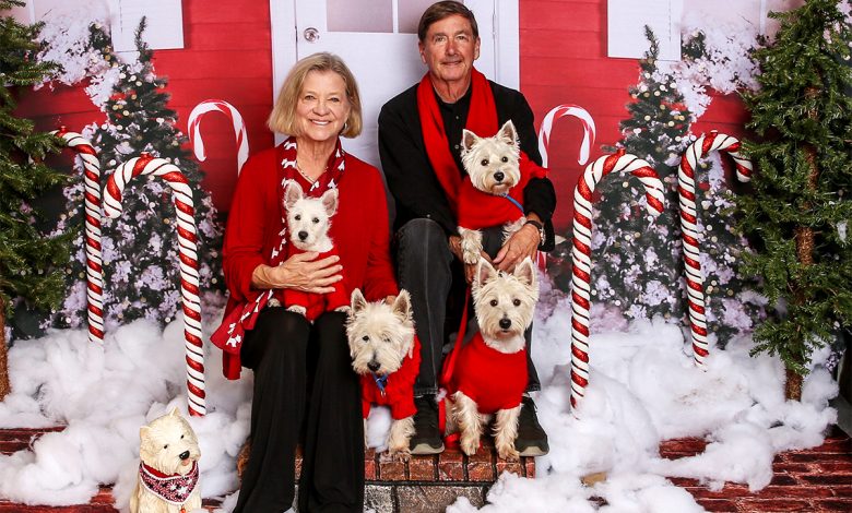 Kay DeLoach with his wife and westies.